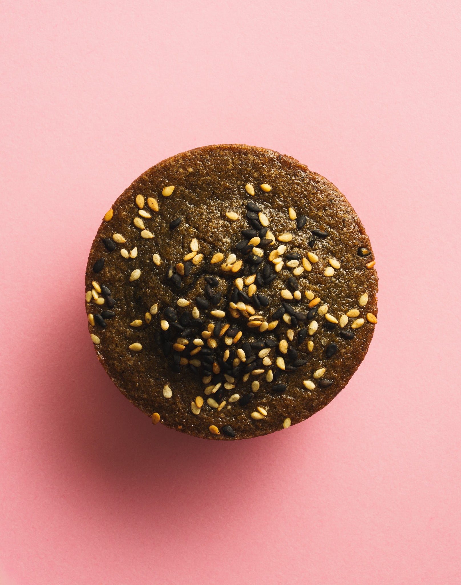 Black sesame butter mochi birdseye view pink background