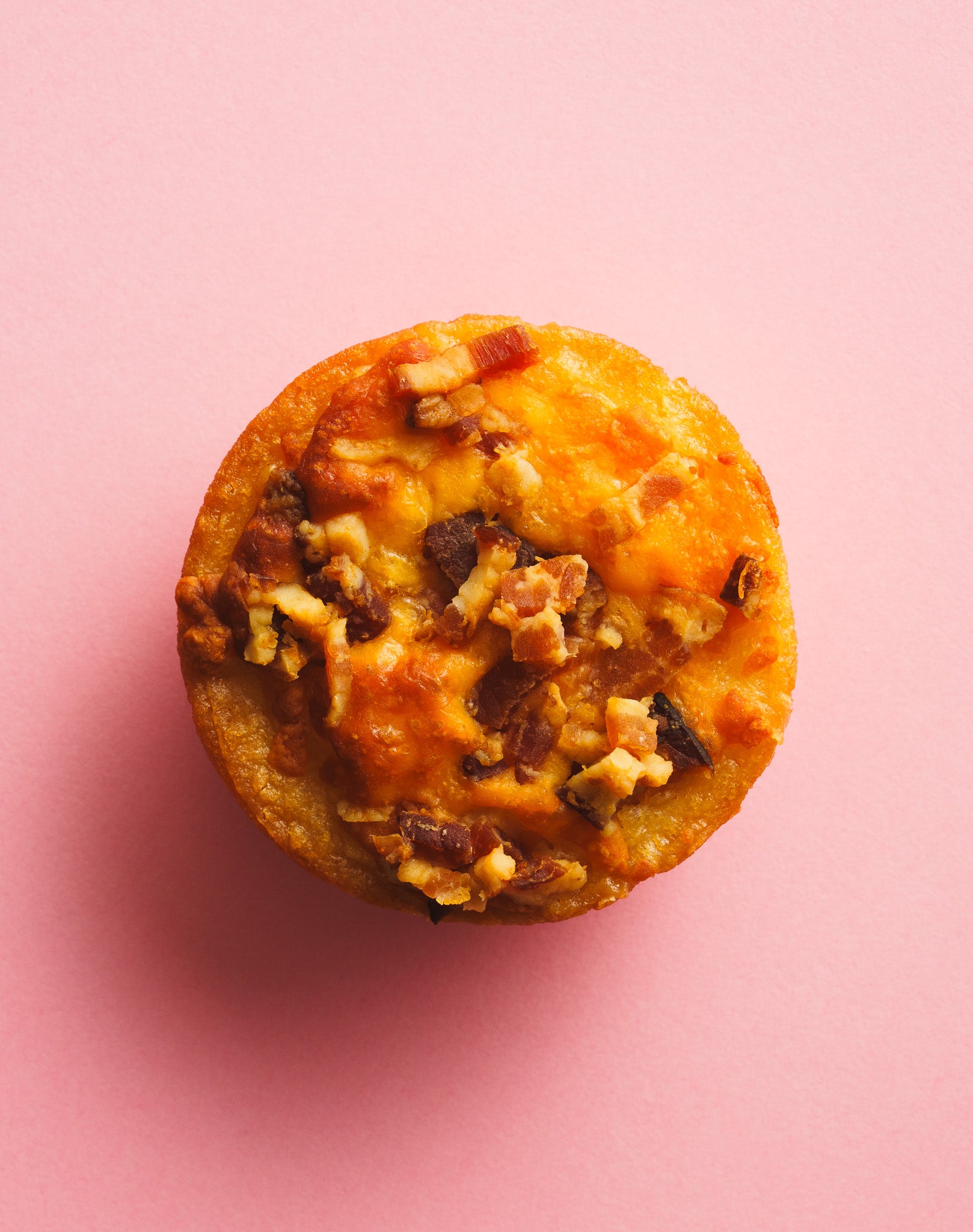 Butter mochi breakfast spread birdseye view pink background